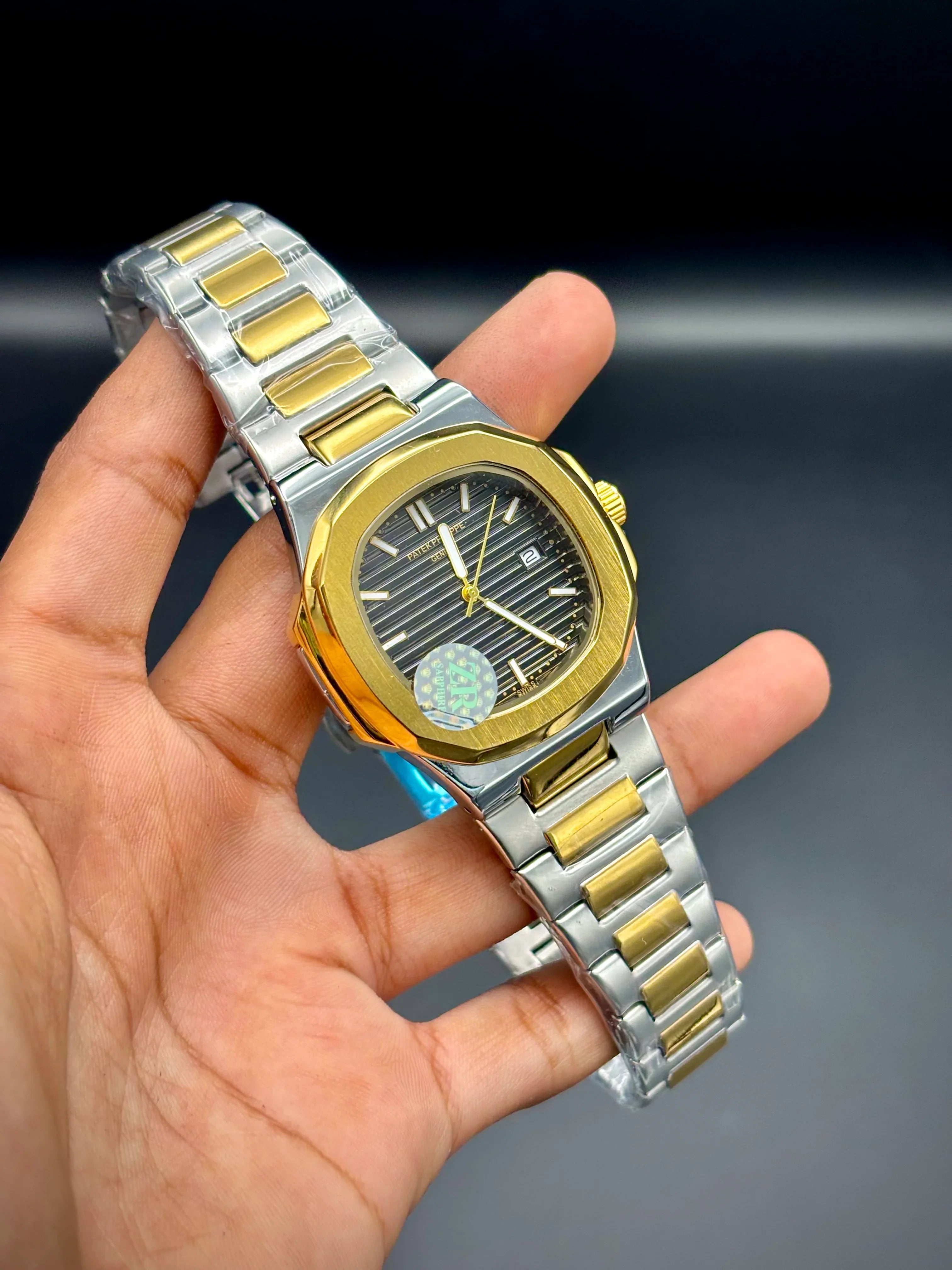 Patek Philippe Nautilus – Grey Dial with Gold Case & Two-Tone Bracelet - elapse