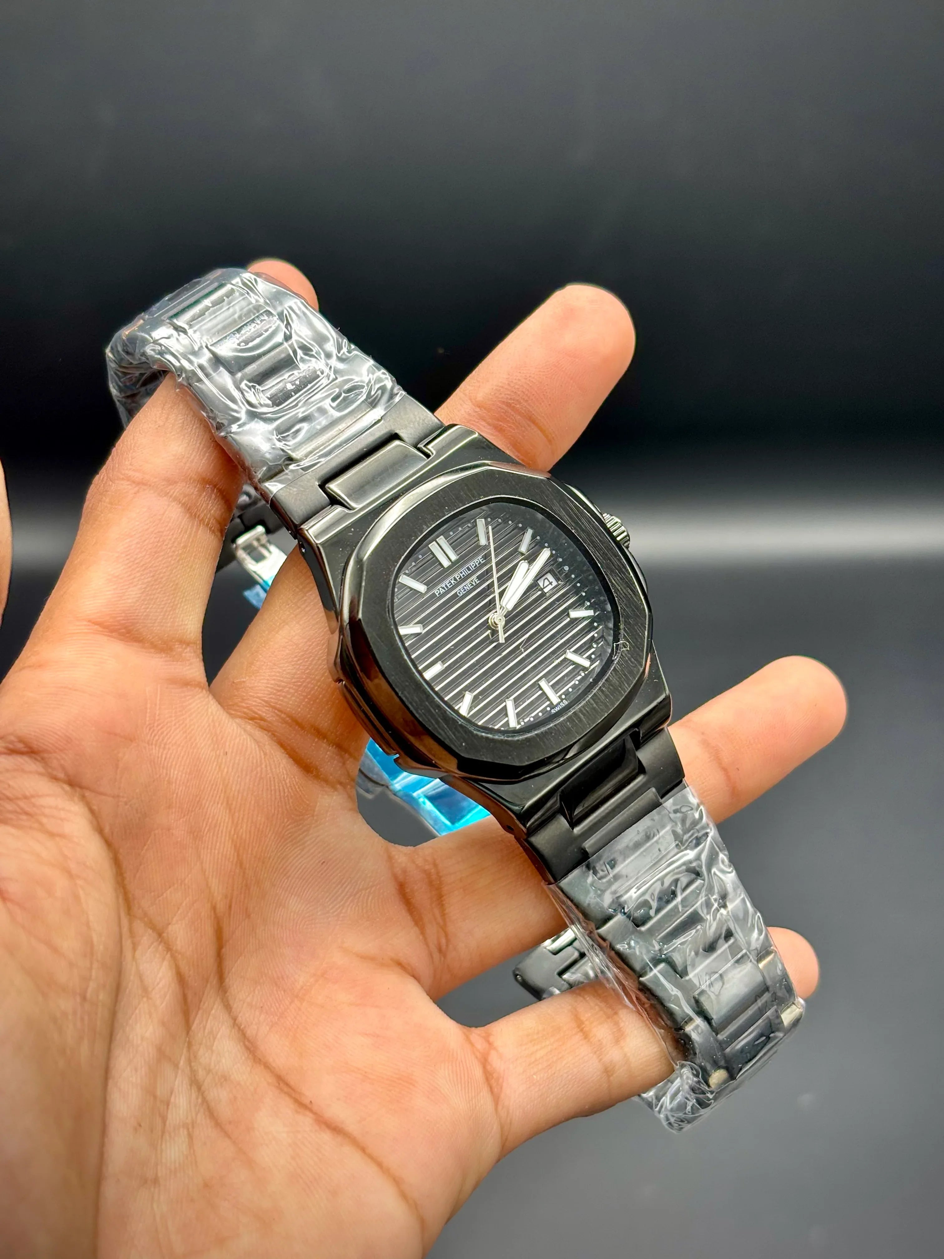 Patek Philippe Nautilus – Black Embossed Dial with Black Stainless Steel Bracelet - elapse