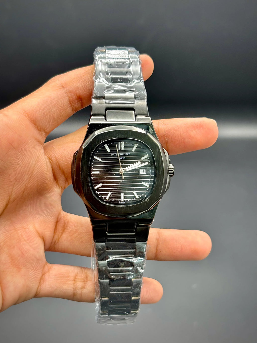 Patek Philippe Nautilus – Black Embossed Dial with Black Stainless Steel Bracelet - elapse