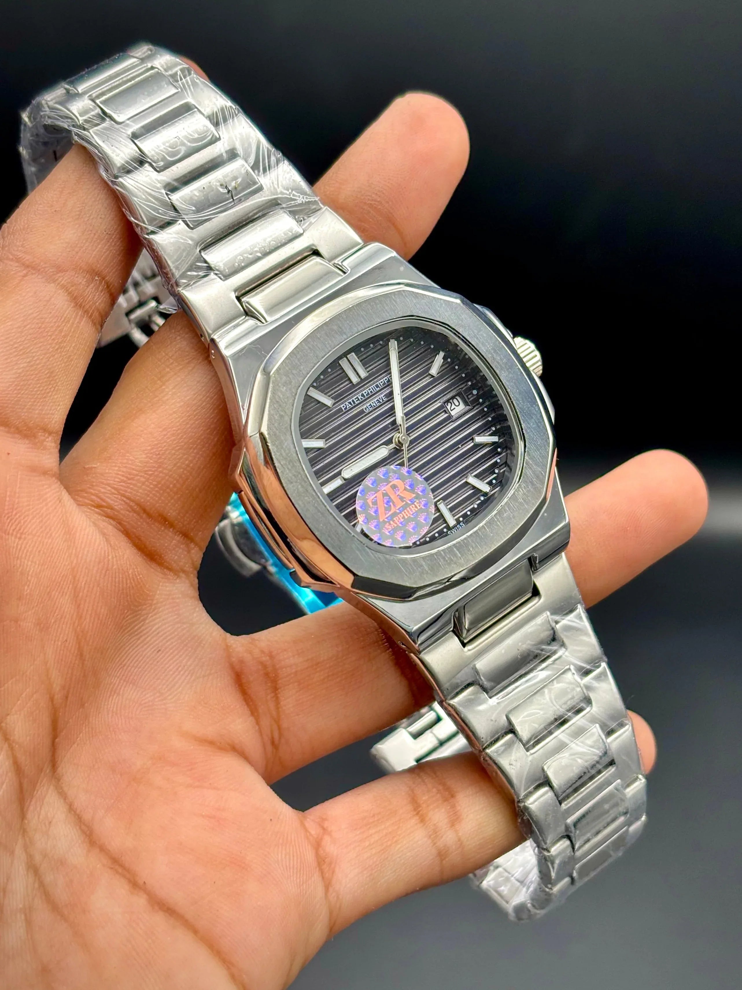 Patek Philippe Nautilus Stainless Steel – Brown Embossed Dial with Date - elapse
