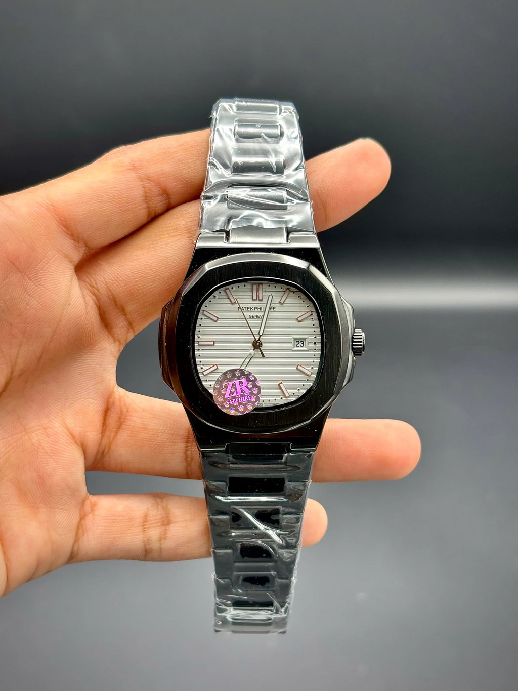 Patek Philippe Nautilus – White Embossed Dial with Black Stainless Steel Bracelet - elapse