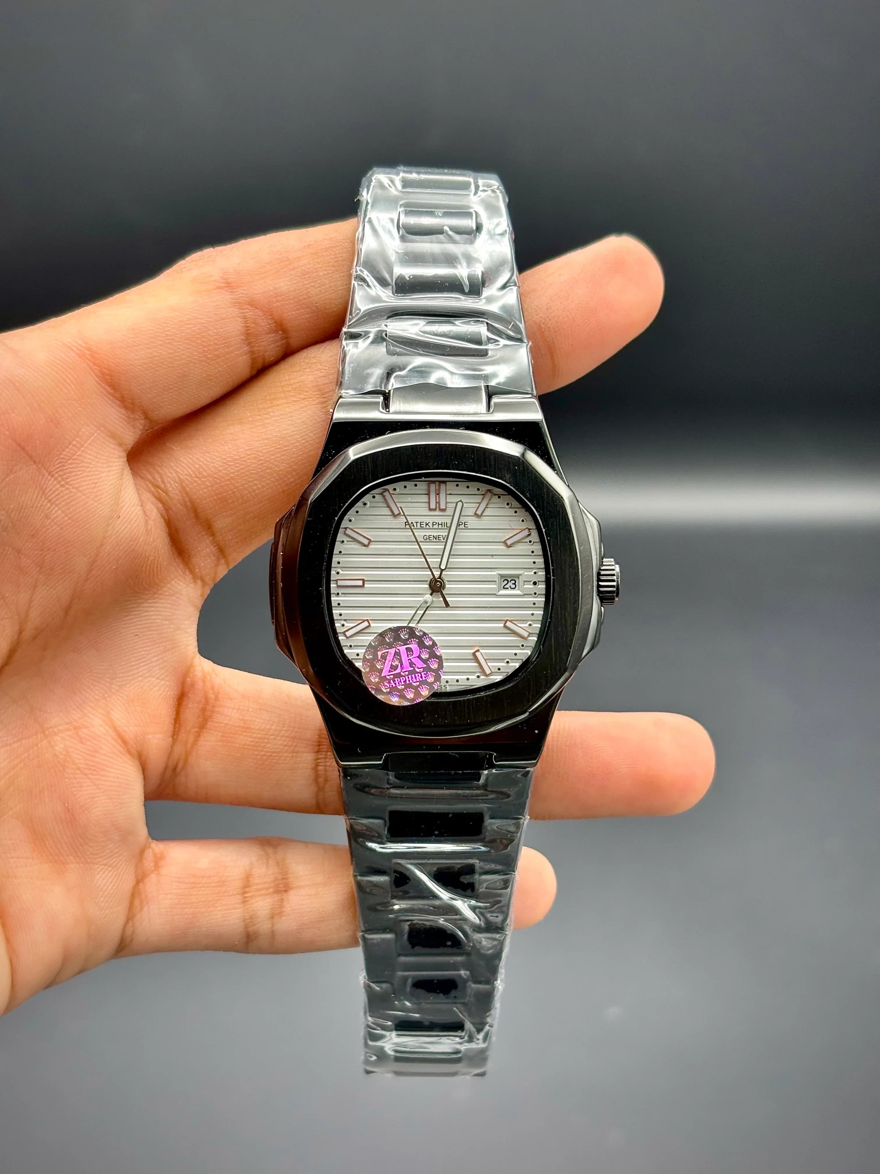 Patek Philippe Nautilus – White Embossed Dial with Black Stainless Steel Bracelet - elapse