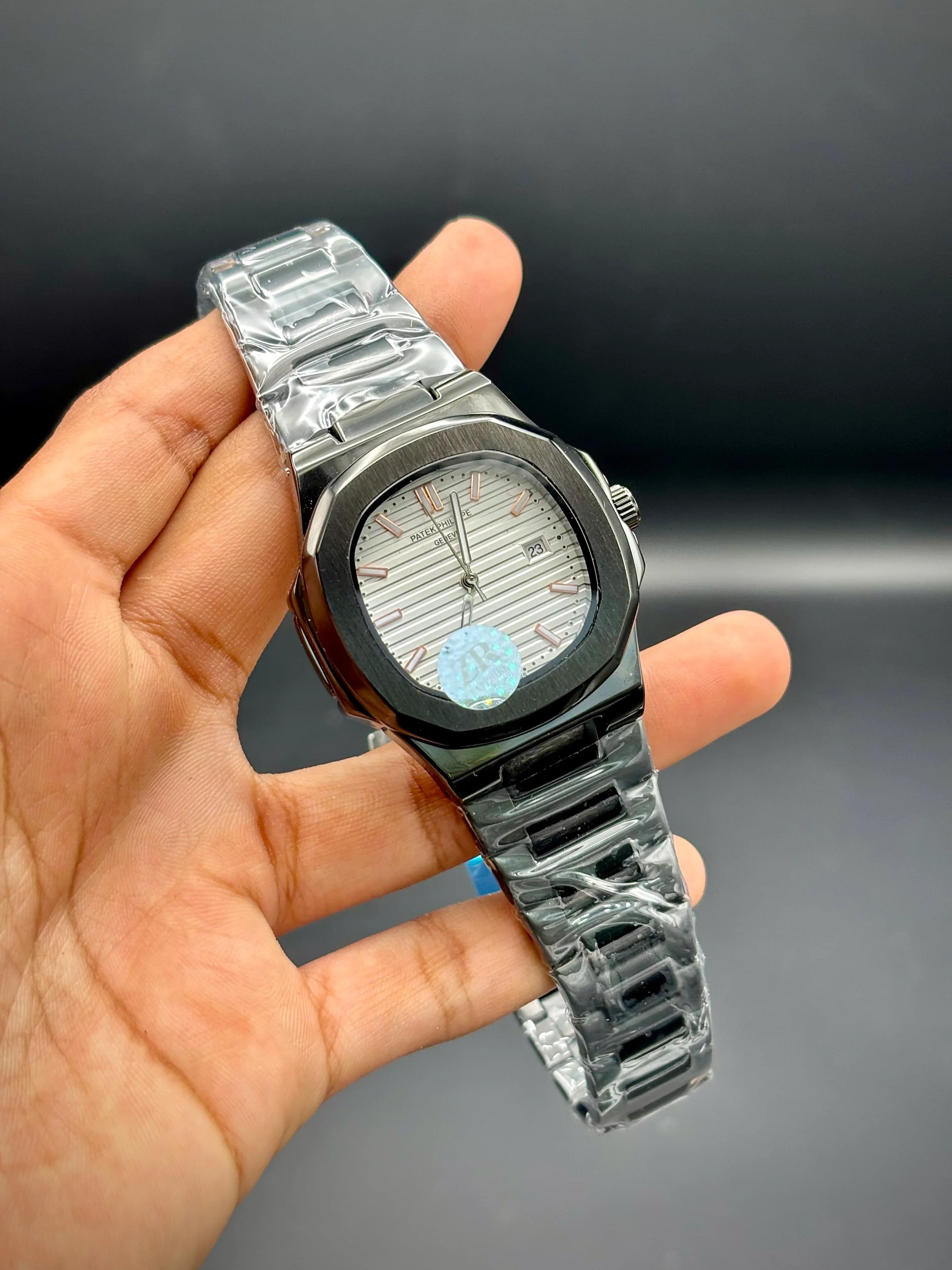 Patek Philippe Nautilus – White Embossed Dial with Black Stainless Steel Bracelet - elapse